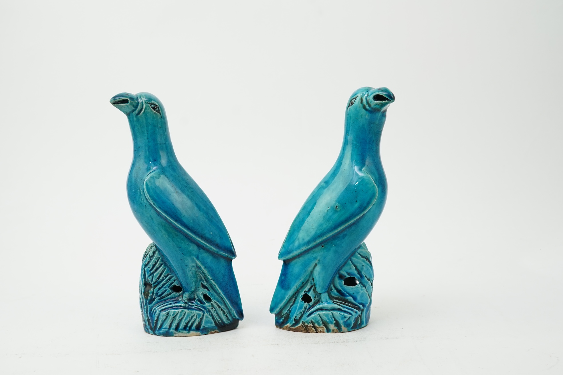 A pair of Chinese turquoise glazed models of parrots, 18th century